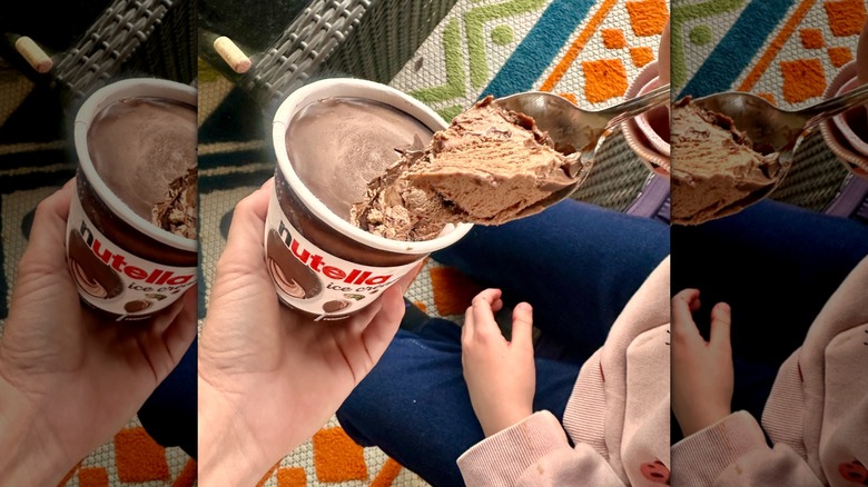 hand holds pint of Nutella ice cream with spoon