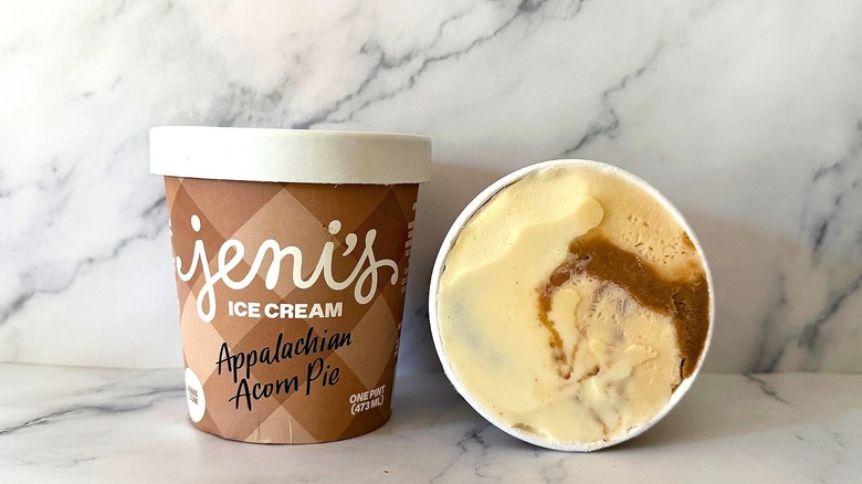 Two pints of Jeni's Appalachian Acorn Pie with one turned on side