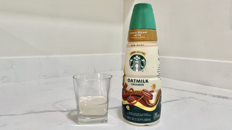 Starbucks Maple Pecan Latte Oatmilk Creamer poured into a cup.