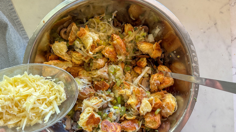 adding cheese to bowl
