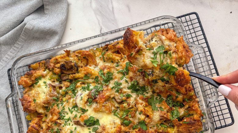 hand scooping out stuffing