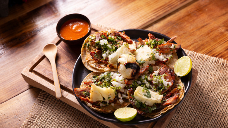 Tacos with a side dish of salsa