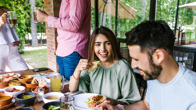 Woman enjoying Latin American food in Mexico