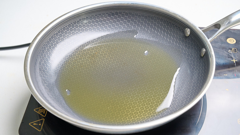 heating oil in a skillet