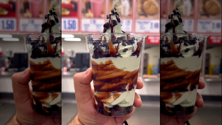 Hand holding Double Chocolate Mint Sundae from Costco food court