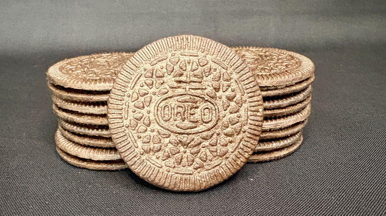 stack of Oreo thins on black background