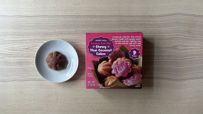 A box of Trader Joe's chew Thai coconut cakes with one on plate.