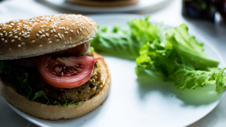burger with lettuce on side