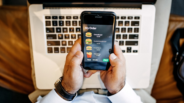 man ordering food on phone