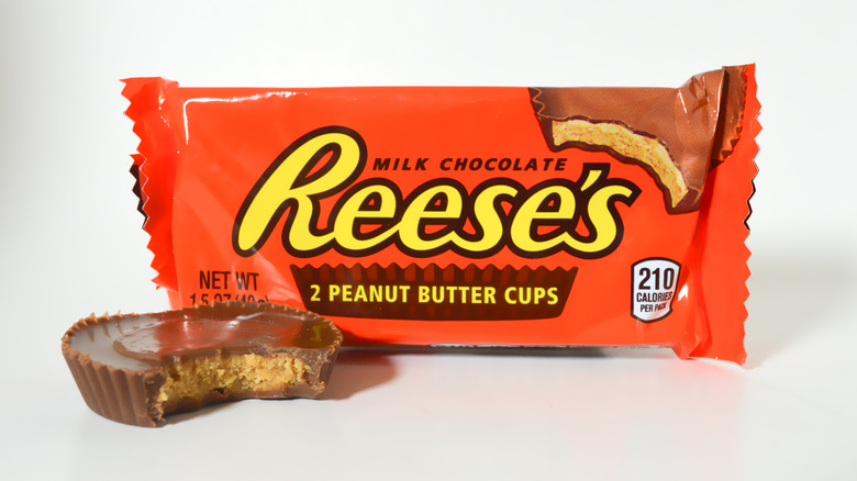 Reese's Peanut Butter Cups pack with a Reese's cup that has a bite taken out