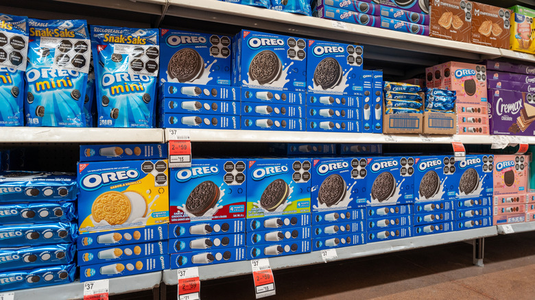 Boxes of various Oreo options on grocery store shelf.
